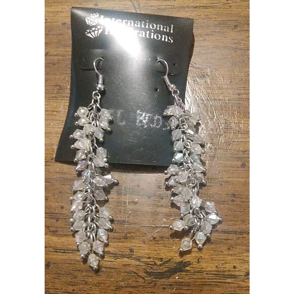 International Inspiration Silver Tone Dangle Chain With Irradesant Bead Earrings - Picture 1 of 2